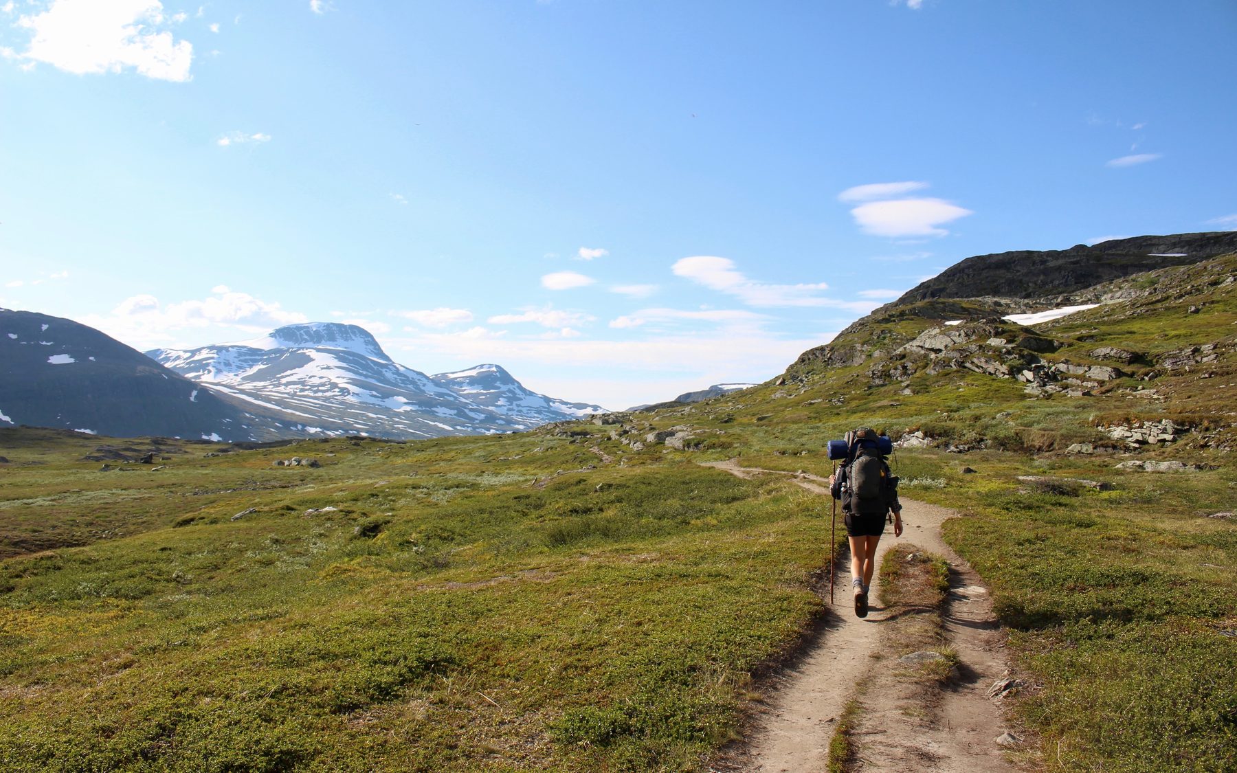 A walker on a mountain path
